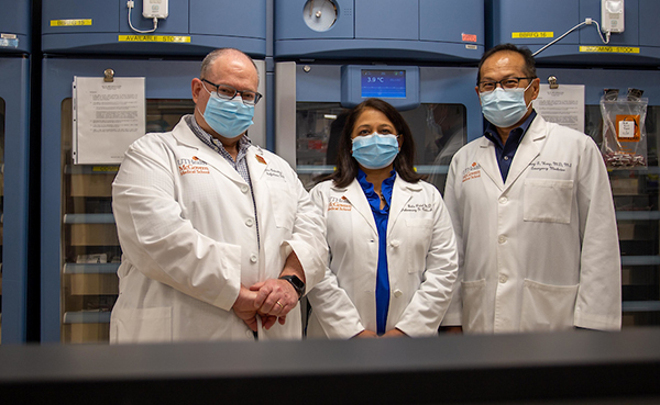 Photo of UTHealth researchers and physicians, from left, Luis Ostrosky, MD; Bela Patel, MD; and Henry Wang, MD, MPH, are leading clinical trials on COVID-19. (Photo by Maricruz Kwon/UTHealth)